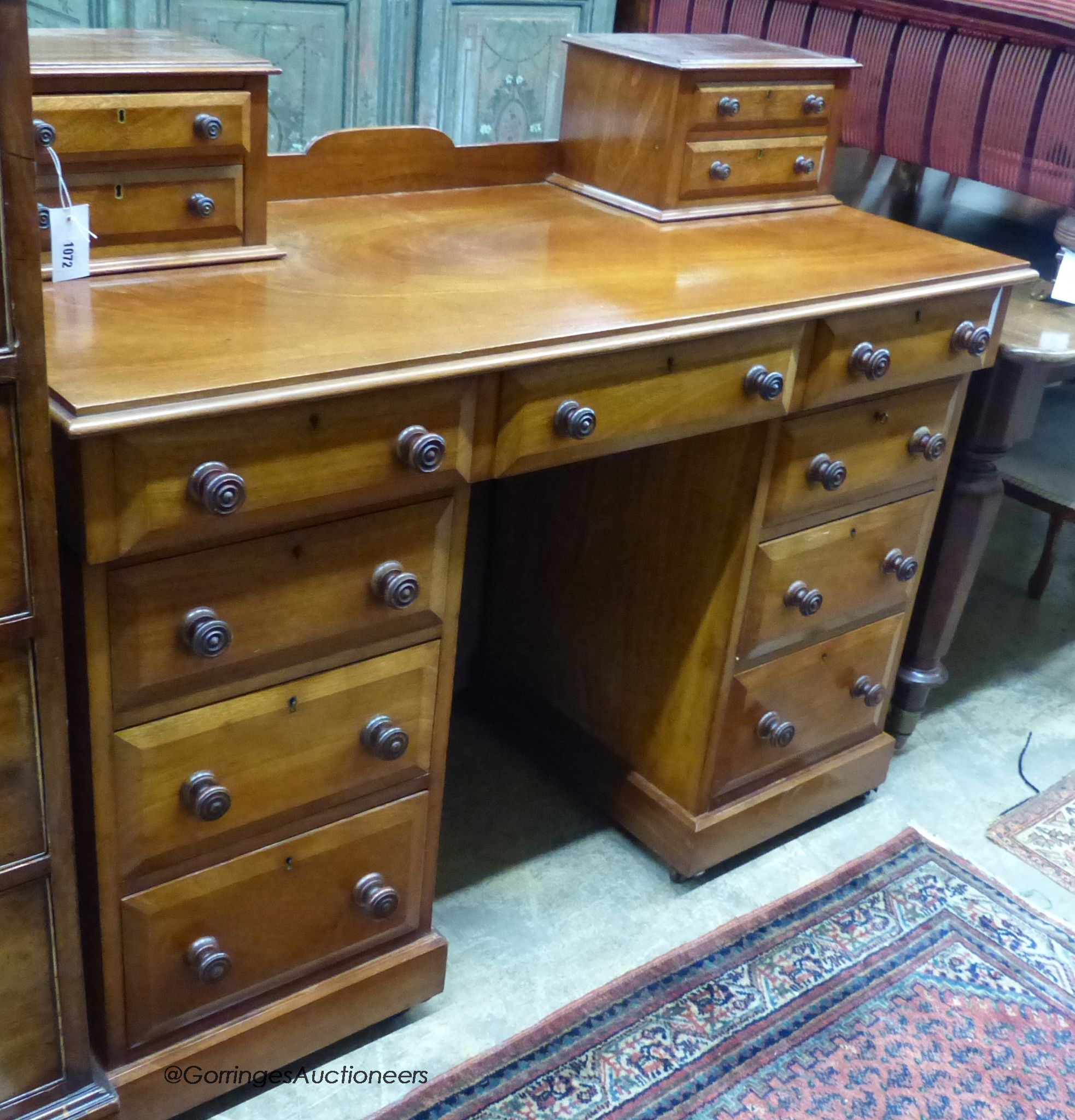 A Victorian mahogany pedestal desk marked Amice Hotton, Jersey, length 122cm, depth 54cm, height 101cm.